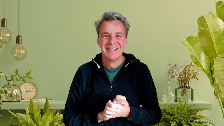 William Ringsdorf presenting the course in a room of plants and pendant lamps